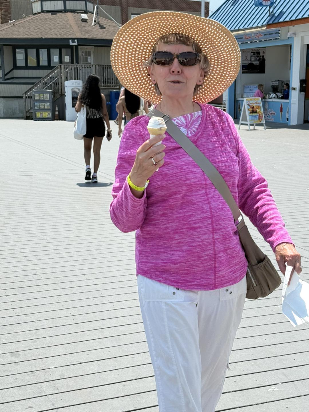 a day at the boardwalk. woman with ice cream